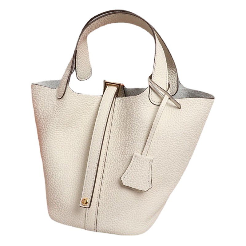 Entrega 2022 color a juego bolsa de cesta de verduras bolsa de cubo de piel de vaca patrón de Litchi primera capa de piel de vaca simple bolso de mujer portátil de todo fósforo