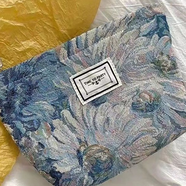 Diseño original de nicho blanco y negro temperamento Jacquard lienzo maquillaje bolsas de mano estilo retro simple flores convenientes