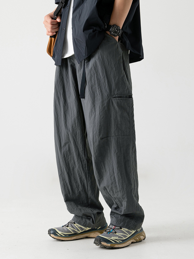 Pantalones casuales de ropa de trabajo de tela antisalpicaduras ligeramente arrugadas para hombres 2025 primavera nuevo cinturón con hebilla pantalones largos funcionales al aire libre