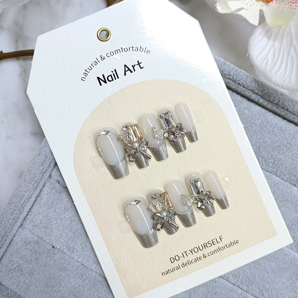 Libro rojo de venta caliente de uñas de ojo de gato portátiles, parches de uñas de fototerapia simples, 10 piezas de uñas hechas a mano.