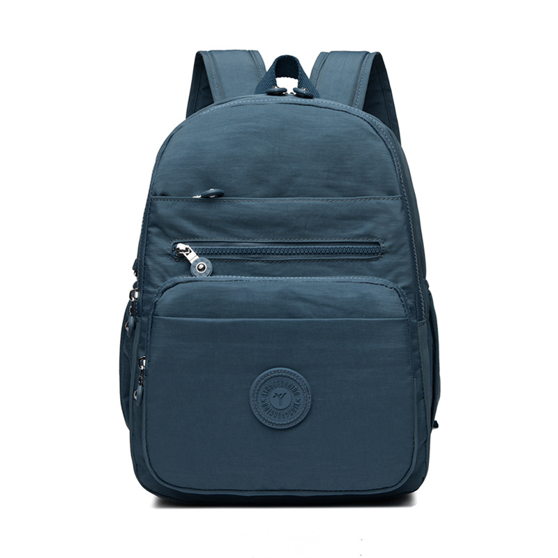 Mochila de hombro de comercio exterior 2025, nueva mochila de computadora simple de color sólido, mochila de escuela secundaria, mochila para hombres y mujeres.