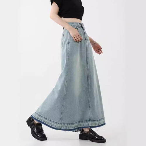 Vintage American design flared denim skirt for women, mini length, featuring frayed edges, high-waisted for a slimming effect, A-line style, suitable for spring.