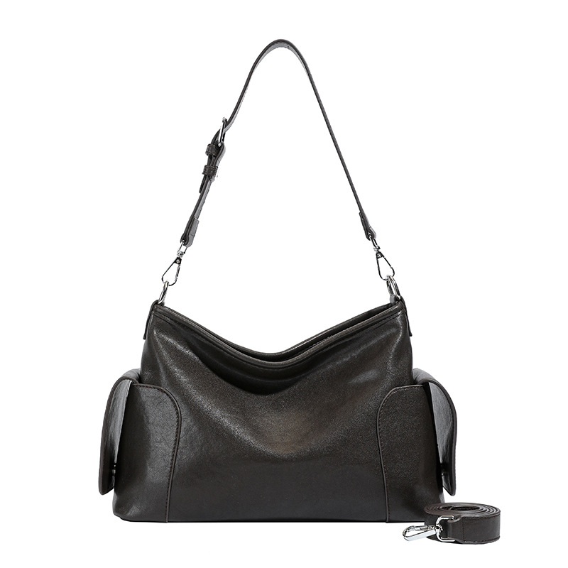 Bolsa de hombro y brazo de nicho francés para mujeres otoño / invierno 2025 nuevo retro mochila de cuero suave bolsa de viaje
