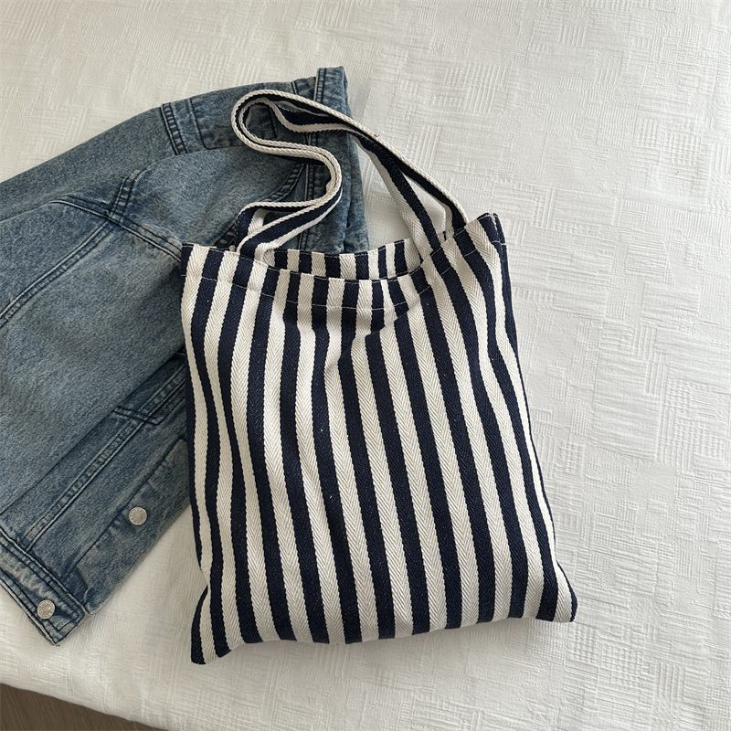 Bolsa de lona a rayas coreana simple bolso de hombro de estudiantes de literatura y arte gran capacidad de lazo bolso de mano