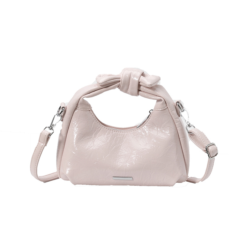 Bolsa de mano de arco para mujeres 2026 nuevo bolso de hombro de moda de verano super caliente sensación diaria mochila de viaje