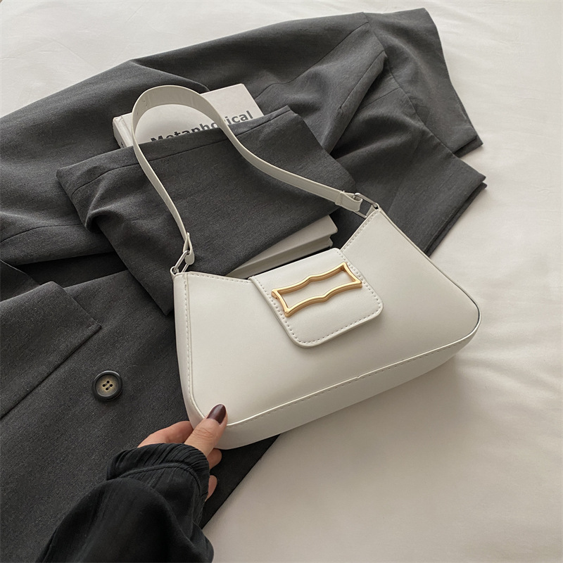 Bolso de brazo ligero de lujo para mujeres 2024 verano nuevo nicho de moda diseño de alta sensación ondulada mochila de hombro