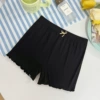 Black trousers with bow
