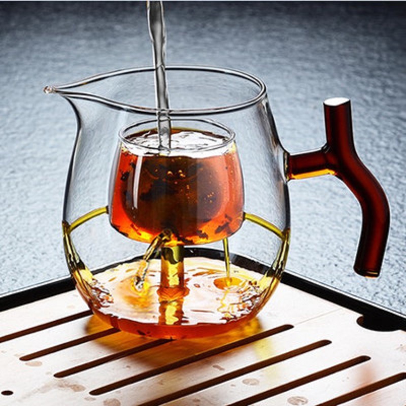 Fábrica al por mayor resistente al calor de alta temperatura de vidrio resistente pequeño verde naranja tetera hirviendo especial tetera Kung Fu taza de té hirviendo