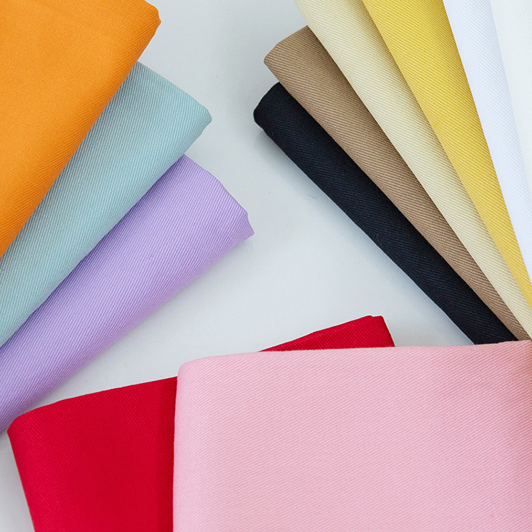 Color 10 * 10s 260gsm teñido de tejido de algodón grueso de hombre de algodón de tela de twill pantalones