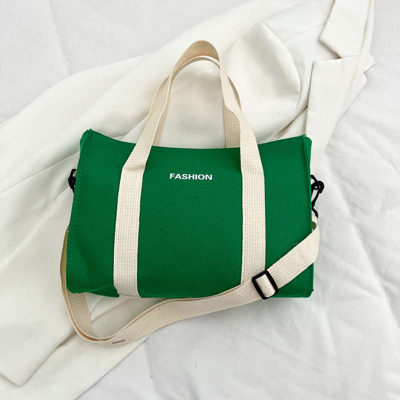 2024 nuevo simple japonés blanco y negro bolso de tela de gran capacidad para estudiantes de clase de viaje mochila de hombro