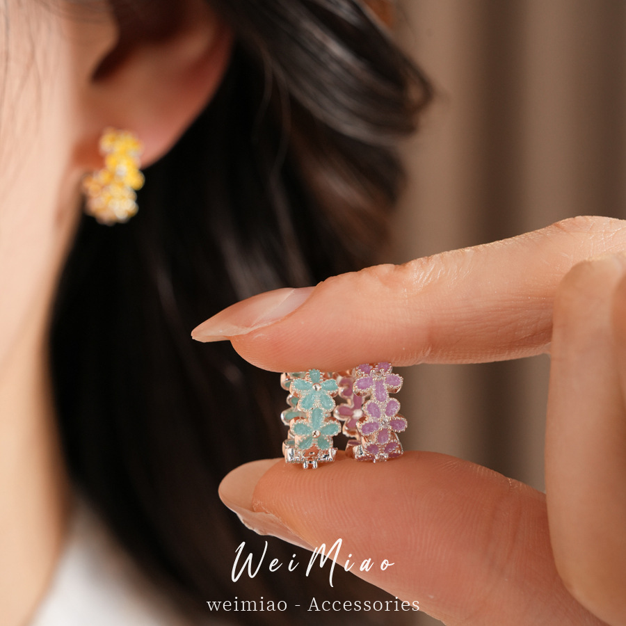 Dopamina color zircón goteo flor aretes redondos frescos aretes dulces lujosos alta sensación auriculares al por mayor