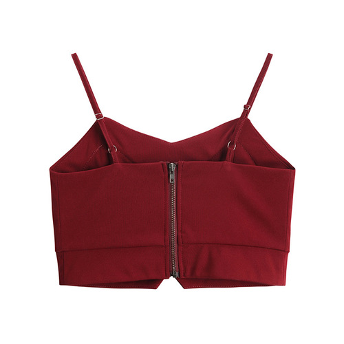 Women's black spaghetti strap backless camisole short sleeve top, with removable cups, versatile for wearing over or under a blazer, highlighting the collarbone and back.