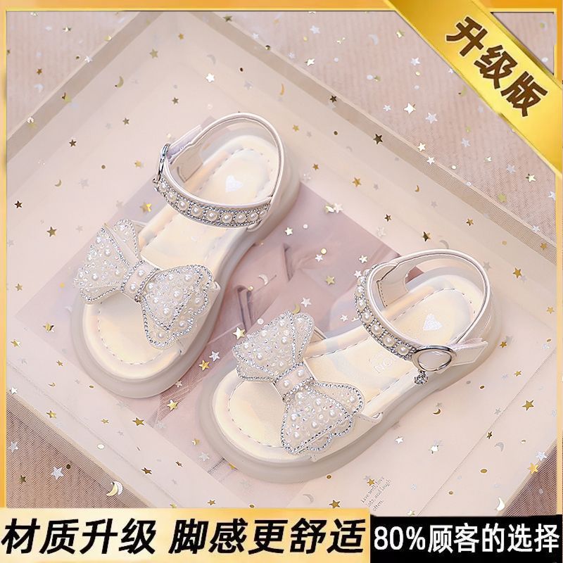 Niños verano 2026 nuevas sandalias de niñas arco brillante con base suave princesa sandalias de viento para niñas sandalias