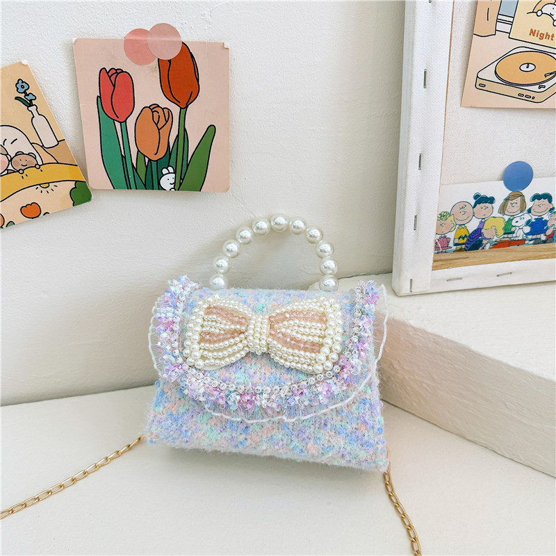 2025 primavera nuevo estilo lentejuelas lazo de perlas niña princesa mano mano accesorios diagonales bolso monedero