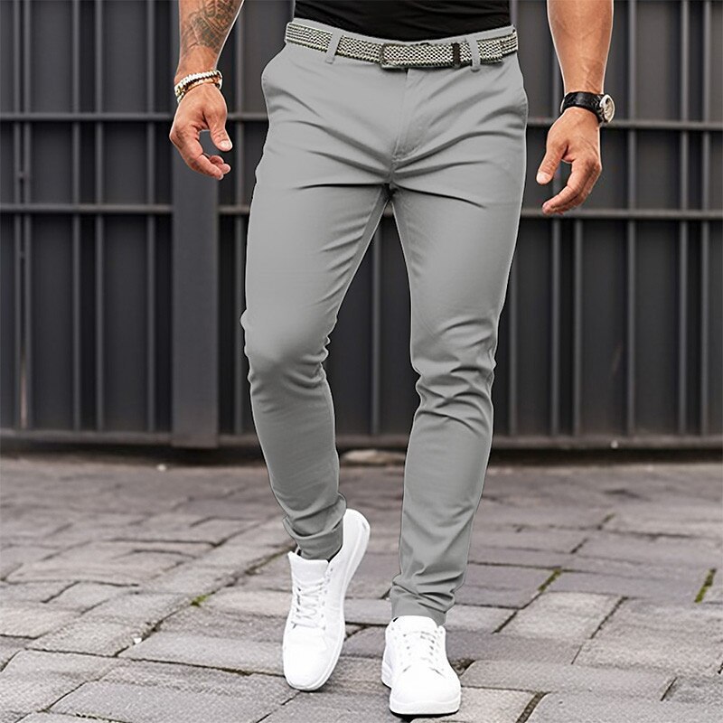 Europa y América estación independiente transfronteriza de los hombres de color sólido bolsillo apretado cremallera negocio casual slim fit pantalones pequeños