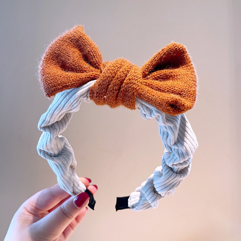 South Korea's Dongdaemun Autumn And Winter New Knitted Bowknot Contrasting Color Headband Western Simple Temperament Pressure Hair Sweet Headband display picture 9