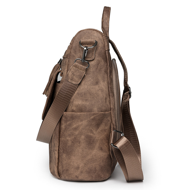 Nuevo estilo mochila mujer 2024 de gran capacidad retro moda borla bandolera viaje de ocio mochila ligera al por mayor