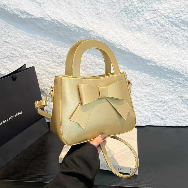 2025 primavera y verano nuevo color sólido bolso de hombro coreano bolso de mujer suave moda simple bolso de arco