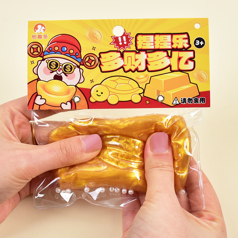 Amasar el barro podrido se siente simulado el oro chino amasar la descompresión para desahogar las barras de oro del fluido del juguete rebotan lentamente para descomprimir