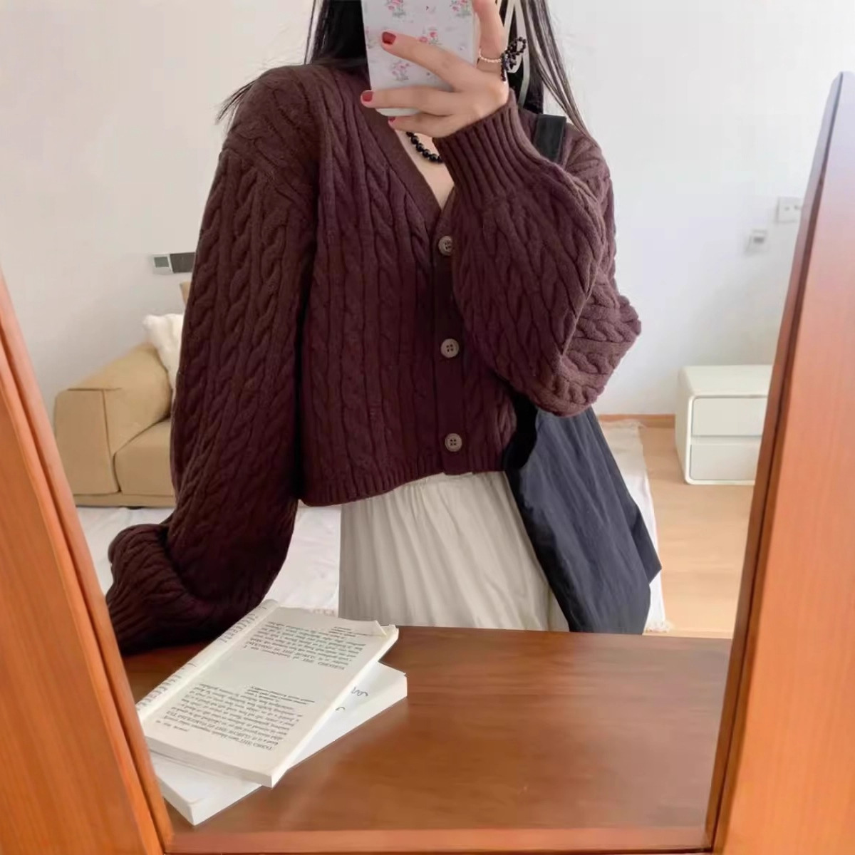 Corea del Sur Dongdaemun simple torcido corto de cintura alta jersey cardigan de punto para mujeres otoño y invierno nuevo suéter de manga de linterna pequeña