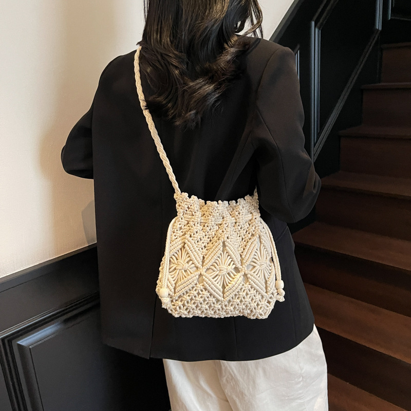 2025 verano nueva moda moda popular mochila de hombro de vacaciones de playa de viaje de playa bolsa de balde de tejido