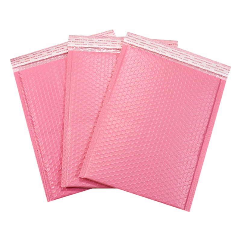 Bolsa de burbujas de película de coextrusión rosa al por mayor bolsa de espuma de sobre gruesa impermeable embalaje expreso bolsa autoadhesiva material de embalaje