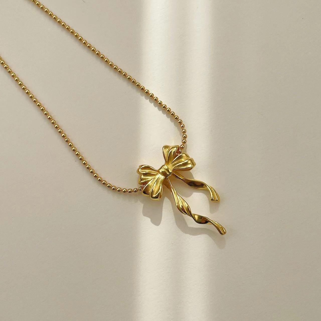 Collier géométrique dynamique à double rangée de nœud papillon pour femme, minimaliste, perles rondes, chaîne ras du cou en alliage plaqué._voghion.com
