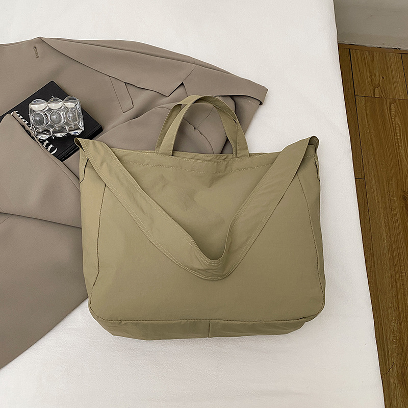 Simple relajado sensación de gran capacidad bolso de lona de hombro de mujer hollow viento versátil bolso de mochila