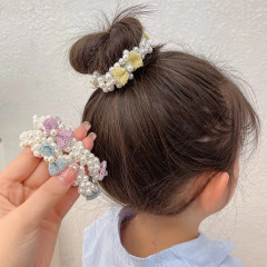 真珠の髪輪日韓の新型ネットの赤い蝶結びの真珠の髪の縄の女の子の子供の韓国式の頭の縄は首の女性の卸売りを結びます。