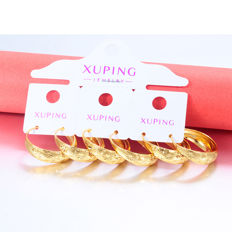 Xuping Europa y los Estados Unidos transfronterizos aretes de flores de aleación de cobre chapado 24k color círculo geométrico imitación de oro ligero lujo temperamento auriculares