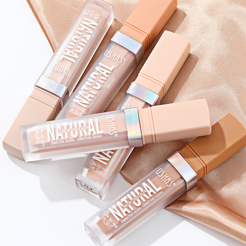 USHAS European and American Cross-border spot corrector base líquida para cubrir las ojeras y las marcas de acné, impermeable y sin maquillaje UC008A B