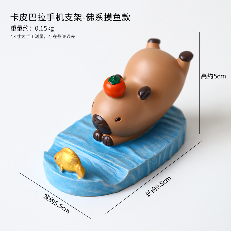 Dibujos animados linda celebridad de Internet Kapibala soporte para teléfono móvil decoración escritorio de oficina estación perezosa soporte plano artefacto