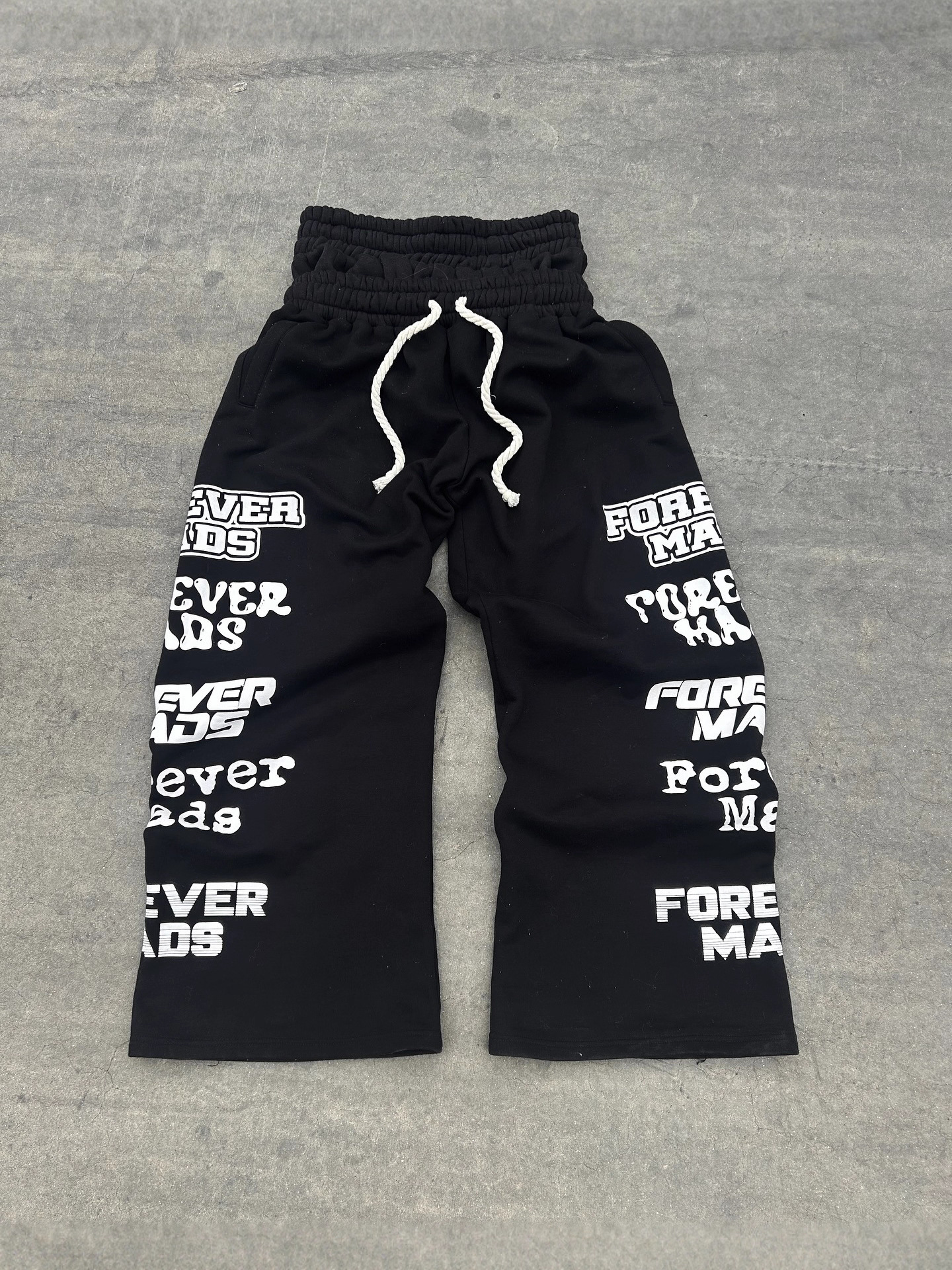 Otoño y invierno nuevos pantalones europeos y estadounidenses de diseño de doble extremo estampado personalidad callejera de piernas largas pantalones casuales para hombres y mujeres image 3