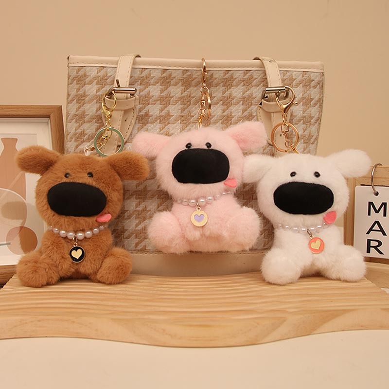 Las celebridades de Internet son lindas y lindas nariz grande colgante de perro de tierra occidental muñeca de peluche bolsa de perro colgante llavero bebé