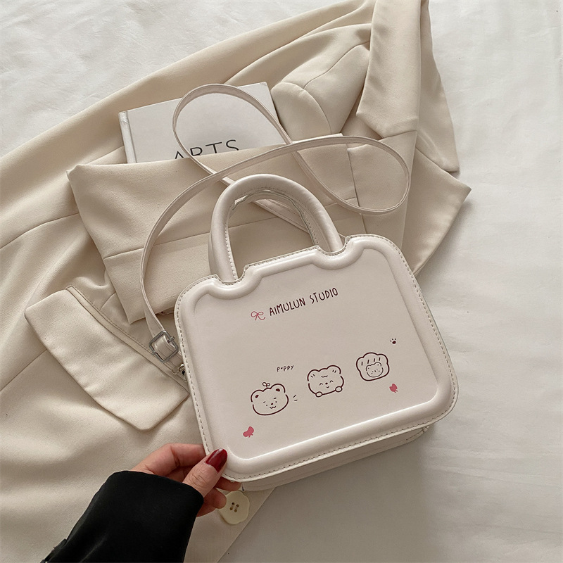 Bolso pequeño de nicho femenino 2025 primavera y verano nuevo estilo bolso bandolera de textura blanca con sentido de diseño bolso de galleta portátil pequeño bolso cuadrado