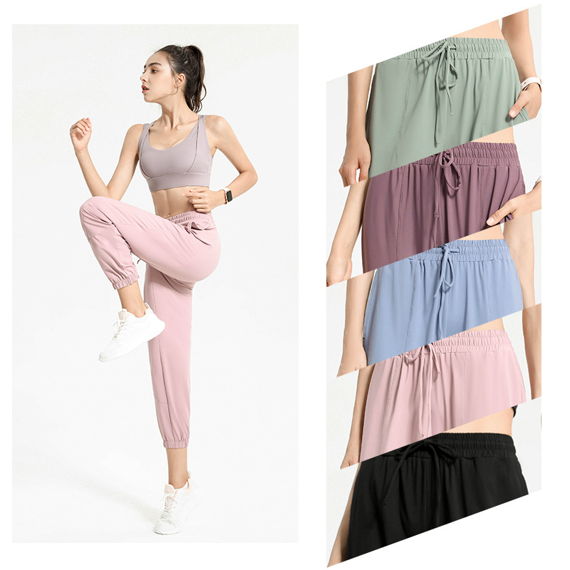 Pantalones deportivos europeos y americanos pantalones largos de protección solar para mujeres con cordón para adelgazar polainas sueltas Otoño e Invierno nuevos deportes más pantalones de Yoga de tamaño
