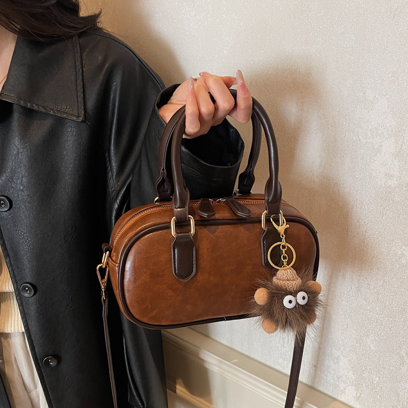 Alto sentido bolso de mano mujer otoño / invierno 2025 nuevo nicho retro bolso de hombro de moda mochila de viaje