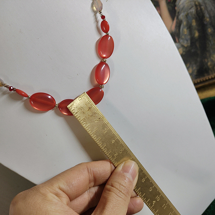 Collana con ciondolo a forma di bambola in pietra di cristallo con fiore e nappa di perle vintage, articolo unico per donna_voghion.com