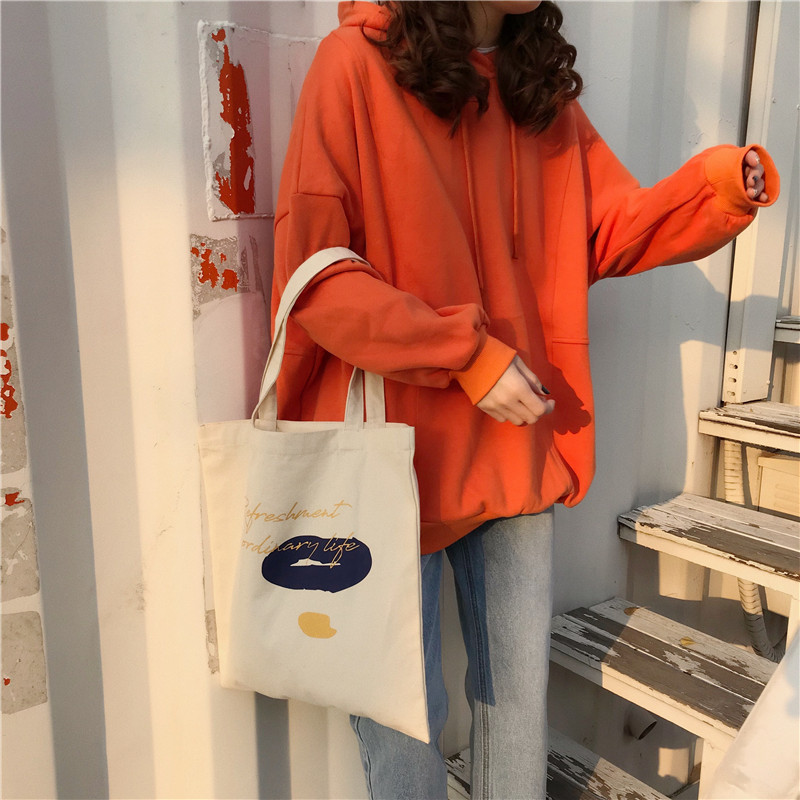 E131 canvas bag, Korean-style ins hand-held shoulder bag, color block letter graffiti shopping bag, female student's search for sources undefined