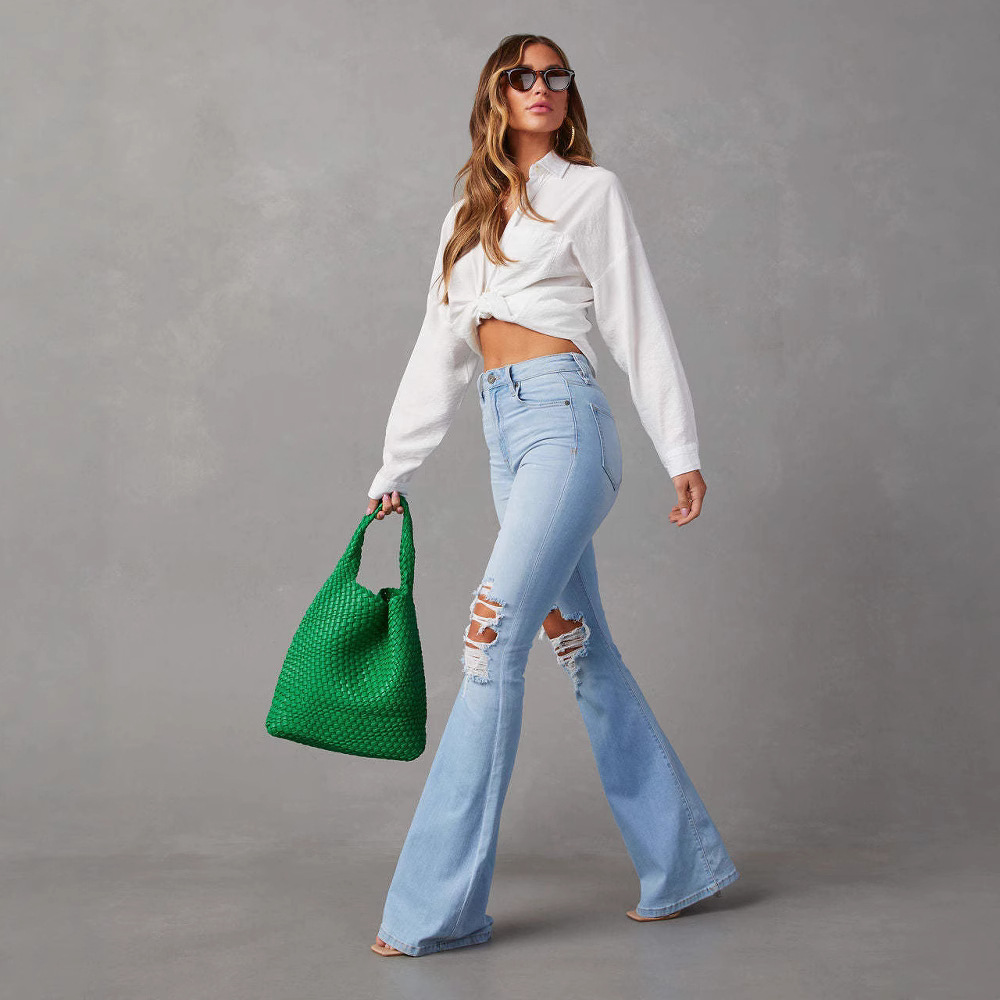 Venta directa de fábrica, nuevos jeans rotos de talle alto estilo europeo y americano para mujer, pantalones acampanados de estilo urbano, pantalones largos 2025