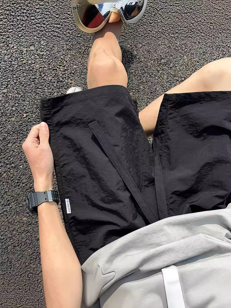 Pantalones cortos deportivos de secado rápido rosa dopamina para hombres 2025 nuevos pantalones de verano de talla grande pantalones sueltos casuales de cinco puntos