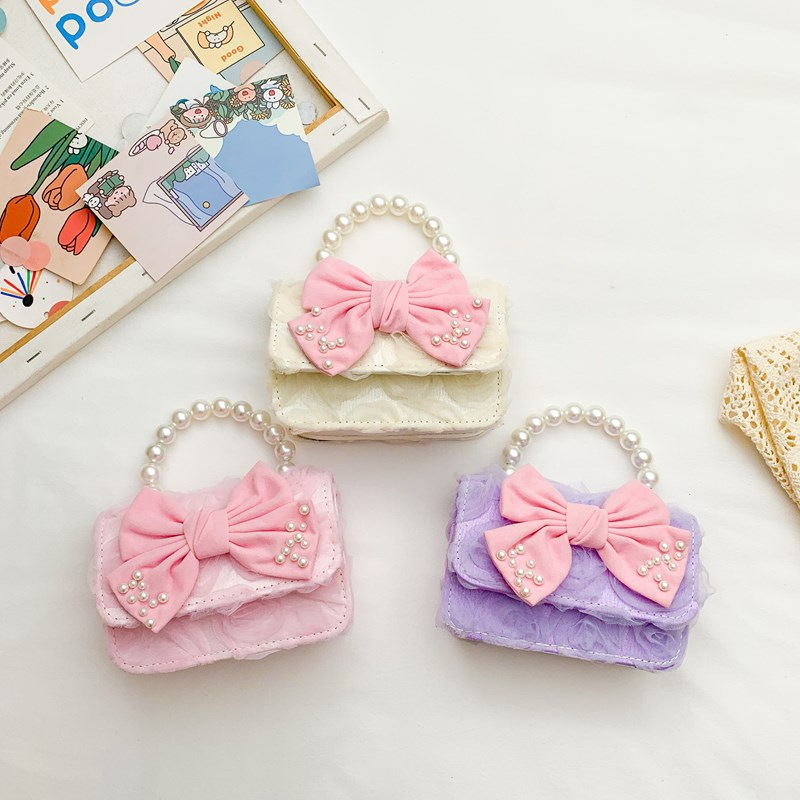 Dulce princesa bolso de hombro de perlas portátiles 2025 mini bolso de cadena de arco para niños