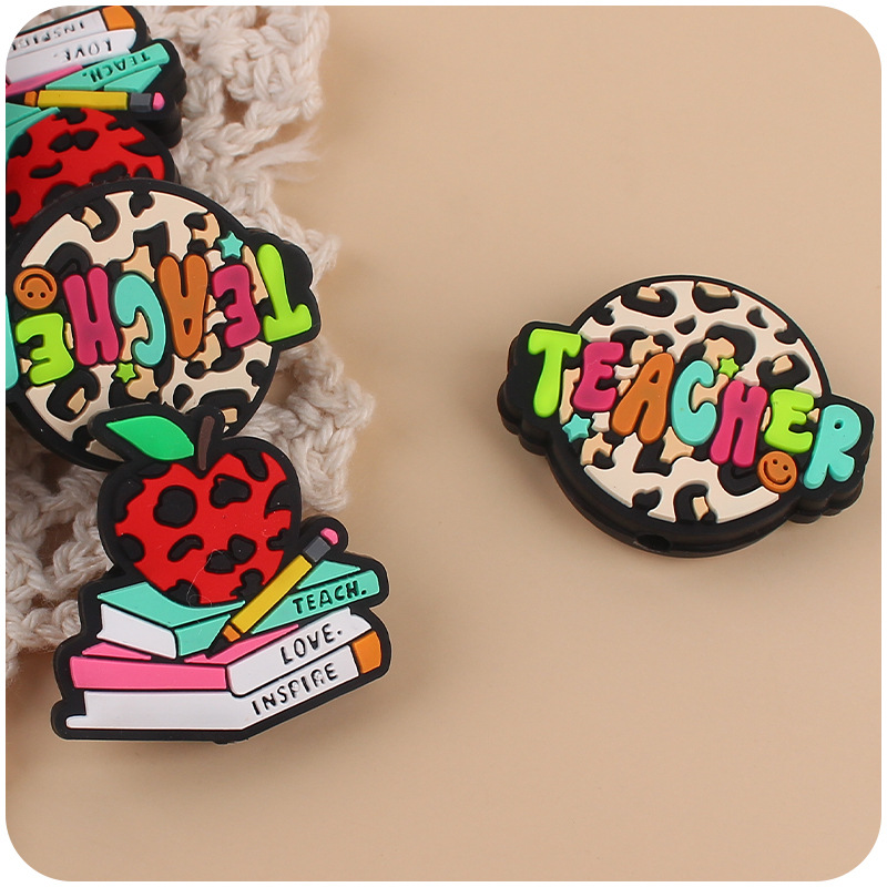 Nueva historieta infantil profesor libro Apple pequeño mordedor creativo DIY bebé molar pezón cadena pequeños accesorios