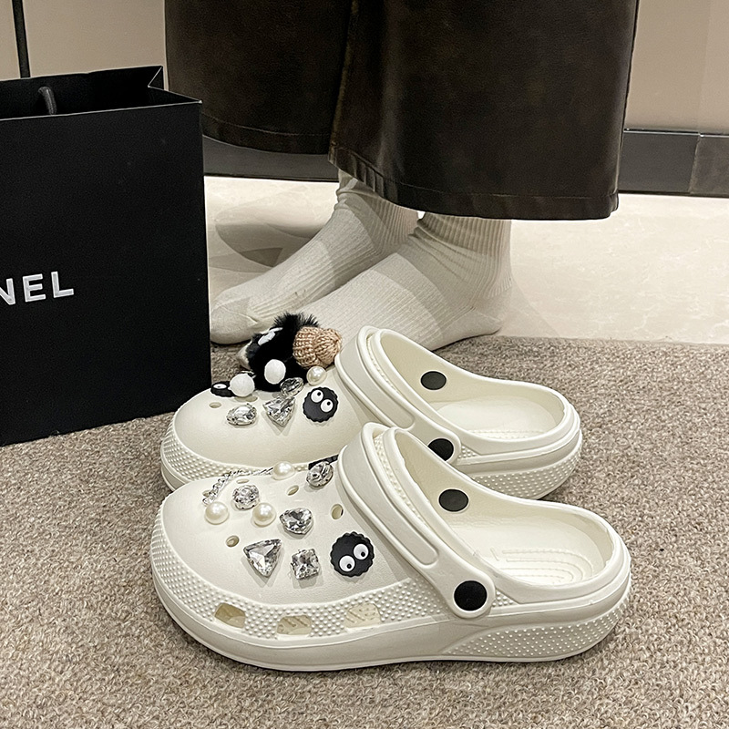 White Crocs-style slippers