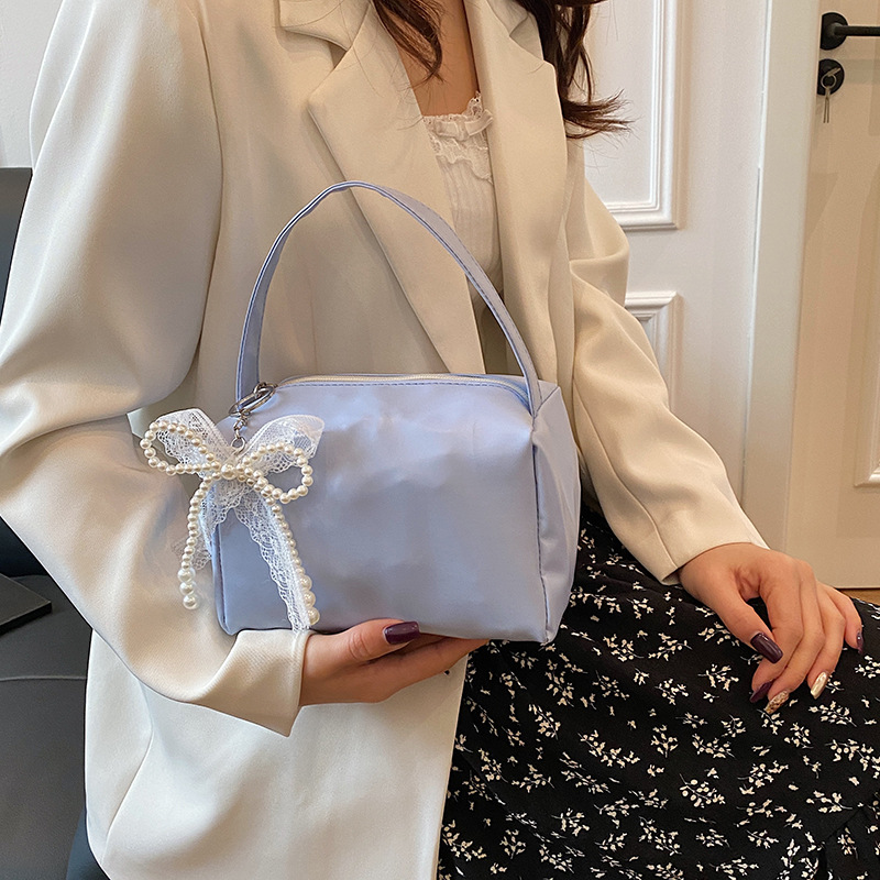 Nicho Zhong fresco dulce bolso de braza para mujeres 2025 primavera y verano nuevo estilo de alta calidad de moda de viaje de hombro bolso de mujer estilo extranjero