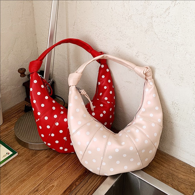 Personalidad de nicho de diseño de bolsas de punto de onda para mujeres 2026 nuevo estilo de moda universal bolsas de hombro bolsas diarias bolsas de brazo de viaje