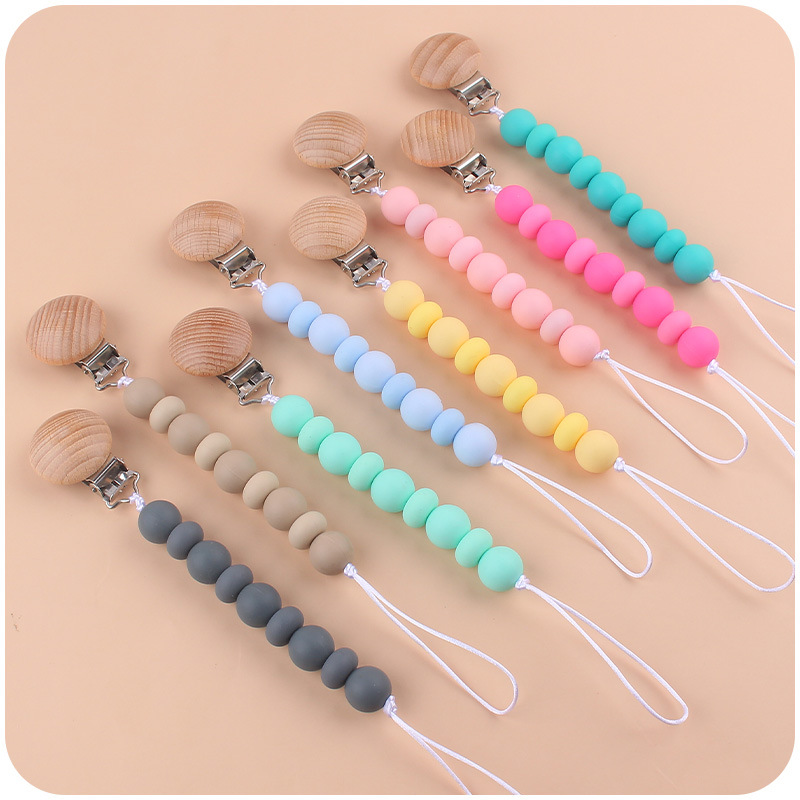Nuevos suministros para bebés clip de chupete de haya calmante cuentas de silicona para bebés Cuentas planas mordedura Cadena de chupete cuerda anti-caída