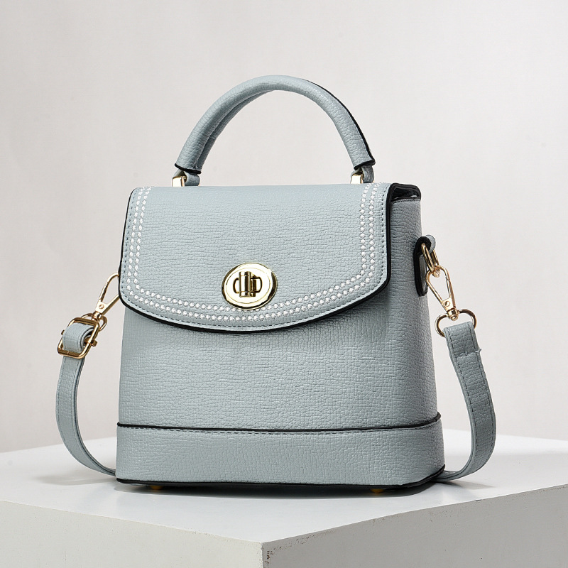 Bolso de mujer nuevo nicho de diseño texturizado bolso de hombro de moda moda bolso de mano práctica mochila bolsas