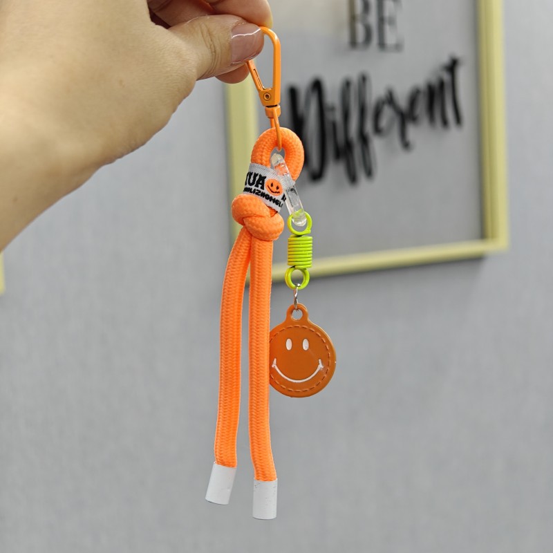 Sonriente cuerda de trenzado llaves de coche bolsos colgantes bolsos accesorios de ropa en caso de teléfono móvil cuerda de color