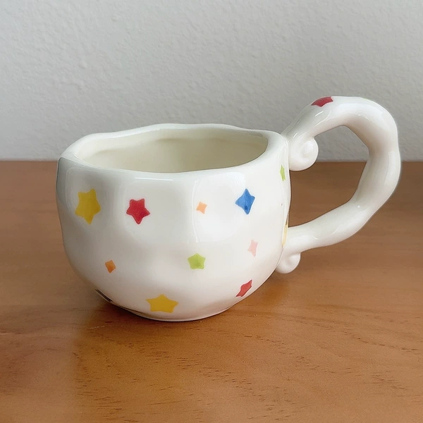 Irregular handle star pattern cup